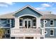 Exterior view of home with balcony and waterfront access at 144 N Casey Key Rd, Osprey, FL 34229