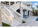 Elegant exterior staircase leading to the pool area at 144 N Casey Key Rd, Osprey, FL 34229