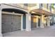 Three-car garage with decorative doors and stone accents at 144 N Casey Key Rd, Osprey, FL 34229