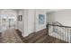 Bright hallway with hardwood floors, and access to upper level at 144 N Casey Key Rd, Osprey, FL 34229