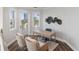 Bright home office features built-in desk and two chairs, offering a dedicated workspace with water views at 144 N Casey Key Rd, Osprey, FL 34229