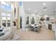 Open concept kitchen with stainless steel appliances and breakfast nook at 144 N Casey Key Rd, Osprey, FL 34229