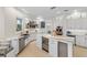 Gourmet kitchen with a stylish island and high-end finishes at 144 N Casey Key Rd, Osprey, FL 34229