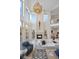 Elegant living room boasting water views and a cozy fireplace at 144 N Casey Key Rd, Osprey, FL 34229
