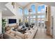 Spacious living room with high ceilings and water views at 144 N Casey Key Rd, Osprey, FL 34229