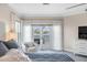 Main bedroom with water views and comfortable seating area at 144 N Casey Key Rd, Osprey, FL 34229