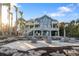 Spacious patio with seating area and waterfront views at 144 N Casey Key Rd, Osprey, FL 34229