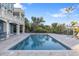 Relaxing pool and spa with patio overlooking water at 144 N Casey Key Rd, Osprey, FL 34229