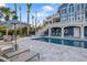 Luxury pool with patio furniture and waterfront views at 144 N Casey Key Rd, Osprey, FL 34229
