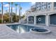 Luxury pool and spa with outdoor kitchen and patio at 144 N Casey Key Rd, Osprey, FL 34229