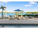 Relaxing pool area with patio furniture and waterfront views at 144 N Casey Key Rd, Osprey, FL 34229