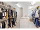 Large walk-in closet with ample hanging space and shelving at 144 N Casey Key Rd, Osprey, FL 34229