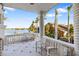 Relaxing balcony overlooking the water, with comfortable seating at 144 N Casey Key Rd, Osprey, FL 34229