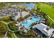 Community pool and clubhouse with surrounding landscape at 16127 Fortezza Dr, Bradenton, FL 34211