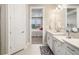 Bathroom with double vanity and view into bedroom at 16127 Fortezza Dr, Bradenton, FL 34211