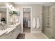 Double vanity bathroom with walk-in shower and large closet at 16127 Fortezza Dr, Bradenton, FL 34211