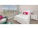 Bedroom with lake view, window blinds, and white bedding at 16127 Fortezza Dr, Bradenton, FL 34211