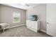 Bright bedroom with window, carpet, and built-in storage at 16127 Fortezza Dr, Bradenton, FL 34211