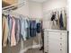 Walk-in closet with custom shelving and hanging rods at 16127 Fortezza Dr, Bradenton, FL 34211