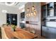 Long live-edge wood table in a modern dining room at 16127 Fortezza Dr, Bradenton, FL 34211