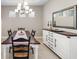 Bright dining room featuring a farmhouse table and white buffet at 16127 Fortezza Dr, Bradenton, FL 34211