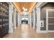 Elegant hallway leading to the Bar House with wood floors at 16127 Fortezza Dr, Bradenton, FL 34211