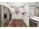Modern kitchen with white cabinets and stainless steel appliances at 16127 Fortezza Dr, Bradenton, FL 34211