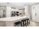 Modern kitchen with white cabinets, stainless steel appliances, and an island at 16127 Fortezza Dr, Bradenton, FL 34211
