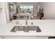 Kitchen sink and countertop with view into the adjacent living room at 16127 Fortezza Dr, Bradenton, FL 34211
