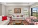 Living room with two sofas, a coffee table, and a view of the backyard at 16127 Fortezza Dr, Bradenton, FL 34211