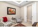 Sitting room with two armchairs, a side table, and sliding doors at 16127 Fortezza Dr, Bradenton, FL 34211