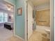 Bathroom with a tub, shower, and accessible features at 19451 Quisto St, Venice, FL 34293