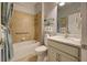 Accessible bathroom with walk-in shower and marble vanity at 19451 Quisto St, Venice, FL 34293