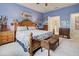 Main bedroom with king bed, ensuite bathroom access, and wood furniture at 19451 Quisto St, Venice, FL 34293