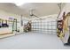 Organized garage with overhead storage and shelving at 19451 Quisto St, Venice, FL 34293