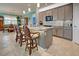 Spacious kitchen with granite countertops, stainless steel appliances, and light gray cabinets at 19451 Quisto St, Venice, FL 34293