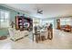 Open living area with comfortable seating, and views into the dining and kitchen area at 19451 Quisto St, Venice, FL 34293