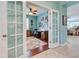 Home office with wood desk and double french doors at 19451 Quisto St, Venice, FL 34293