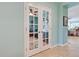 Bright home office with built-in shelving and French doors at 19451 Quisto St, Venice, FL 34293