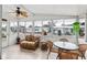 Bright screened porch with wicker furniture and view of the community at 2107 Palma Sola Blvd # 59, Bradenton, FL 34209