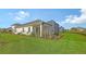 Home features a large backyard, screened porch and nice landscaping at 21628 Lake Placid Way, Venice, FL 34293