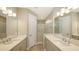 Double vanity bathroom with a large shower at 21628 Lake Placid Way, Venice, FL 34293