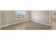 Spacious bedroom with tile floors and large window at 21628 Lake Placid Way, Venice, FL 34293