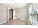 Spacious bedroom with tile floors and window at 21628 Lake Placid Way, Venice, FL 34293
