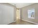 Bedroom with double door closet and view to another room at 21628 Lake Placid Way, Venice, FL 34293