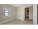 Bedroom with tile flooring and access to bathroom at 21628 Lake Placid Way, Venice, FL 34293