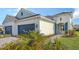 Front view of a charming two-story house with a two-car garage at 21628 Lake Placid Way, Venice, FL 34293