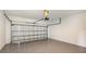 Clean and spacious garage with automatic door opener and epoxy flooring at 21628 Lake Placid Way, Venice, FL 34293