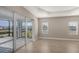 Gathering room with sliding glass doors leading to a covered patio at 21628 Lake Placid Way, Venice, FL 34293