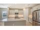 Modern kitchen with stainless steel appliances and an island at 21628 Lake Placid Way, Venice, FL 34293